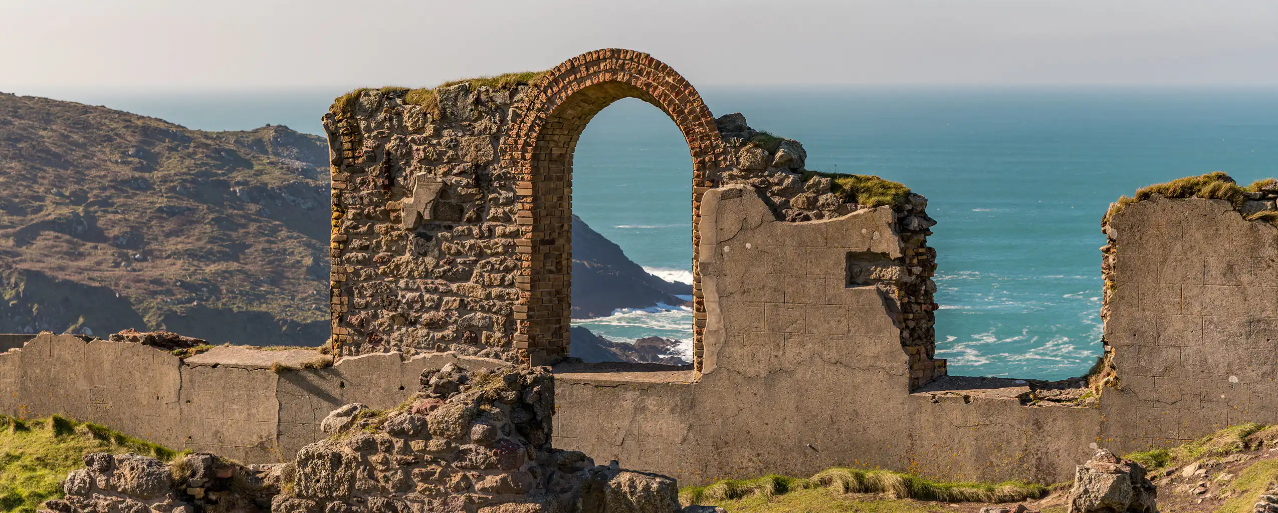 Ruins of Botallack Mine perched on cliffs, overlooking the ocean near in Morvah, a great place to visit from a Morvah Holiday Cottage.