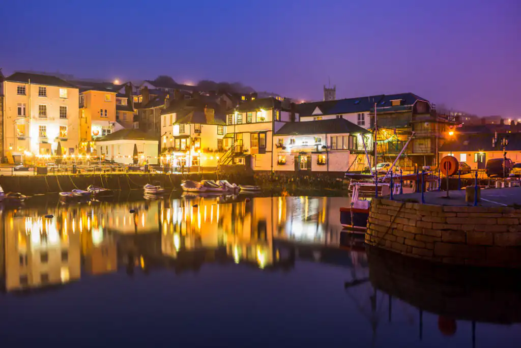 A tranquil view of Falmouth Harbour, Cornwall, showcasing the calm waters as New Year festivities begin.