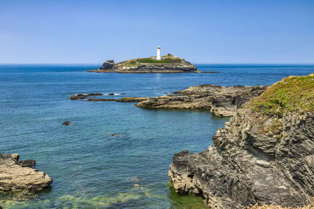 Godrevy Lighthouse located near Gwithian Beach near Hayle is a popular sight seeing attraction in Cornwall.