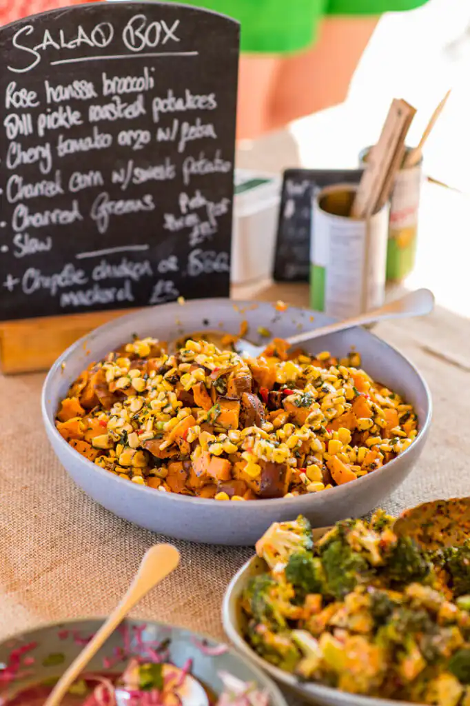 A colourful spread of diverse foods on a table at the St Ives Food Festival, showcasing local culinary delights.
