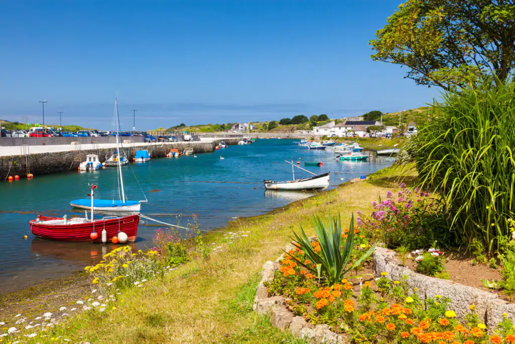 A vibrant blue sky enveloping Hayle, a picturesque village in Cornwall perfect for visitors.