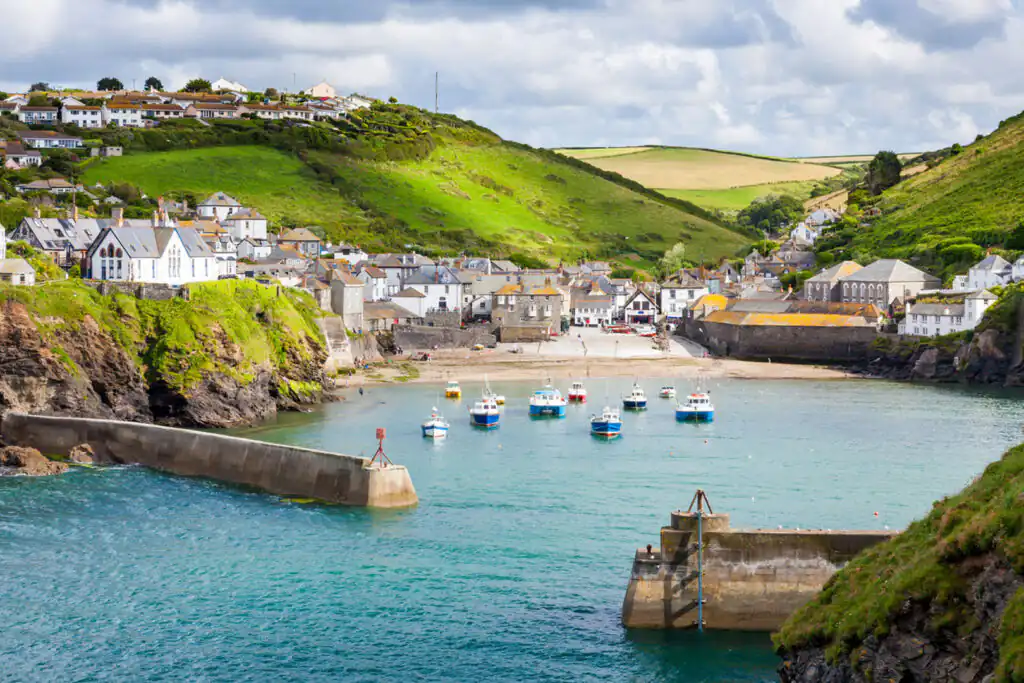 Tranquil waters of Port Isaac, a picturesque fishing village in Cornwall, inviting exploration and adventure.