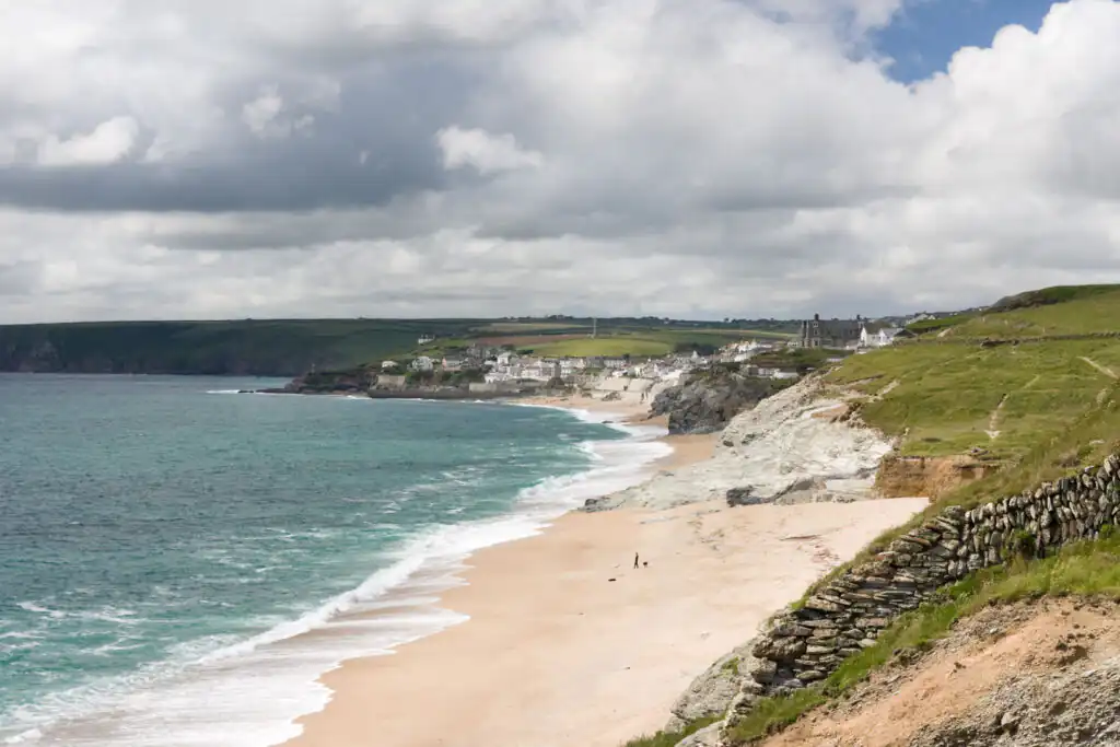 Overlooking Porthleven Beach and dramatic cliffs from a hill, highlighting one of Cornwall's best surf spots.
