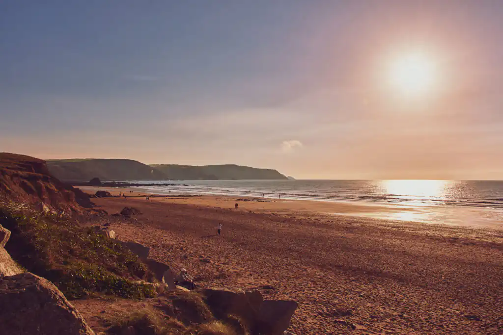 Widemouth Bay features a beautiful expanse of water, perfect for surfing and enjoying the coastal scenery of Cornwall.