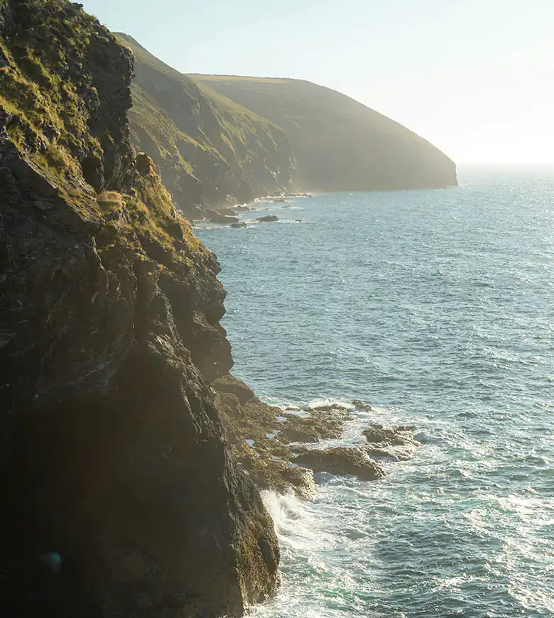 Scenic cliff edges along the St Agnes Head Coastal Path in Cornwall, overlooking the sea.