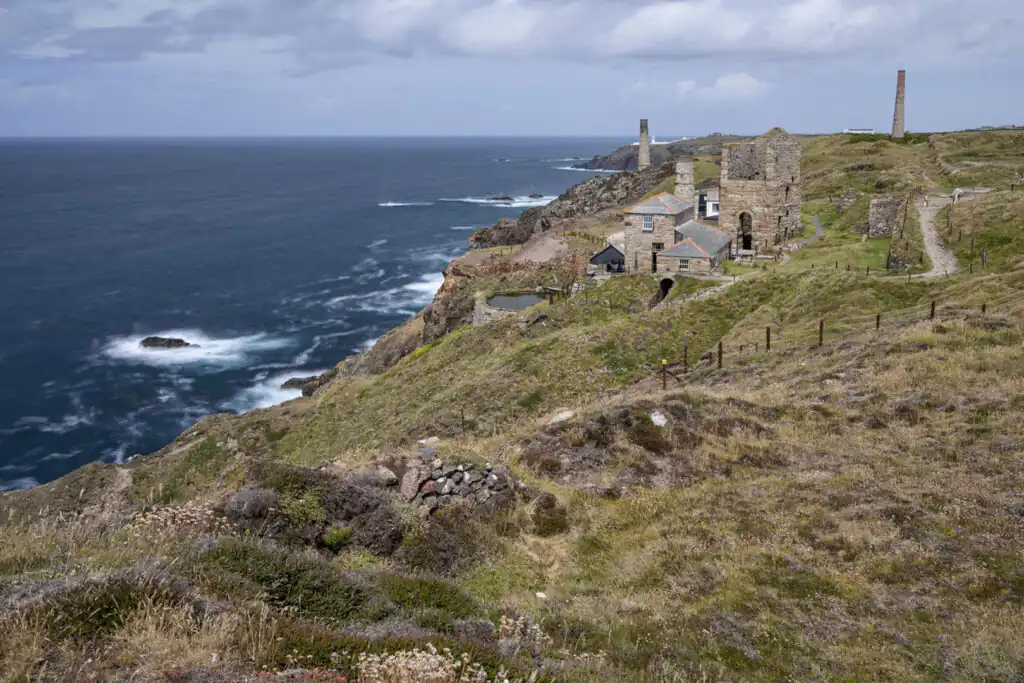 A cliffside view featuring Levant Mine in West Cornwall, a locations that inspired many novels by Patrick Gale in Cornwall.