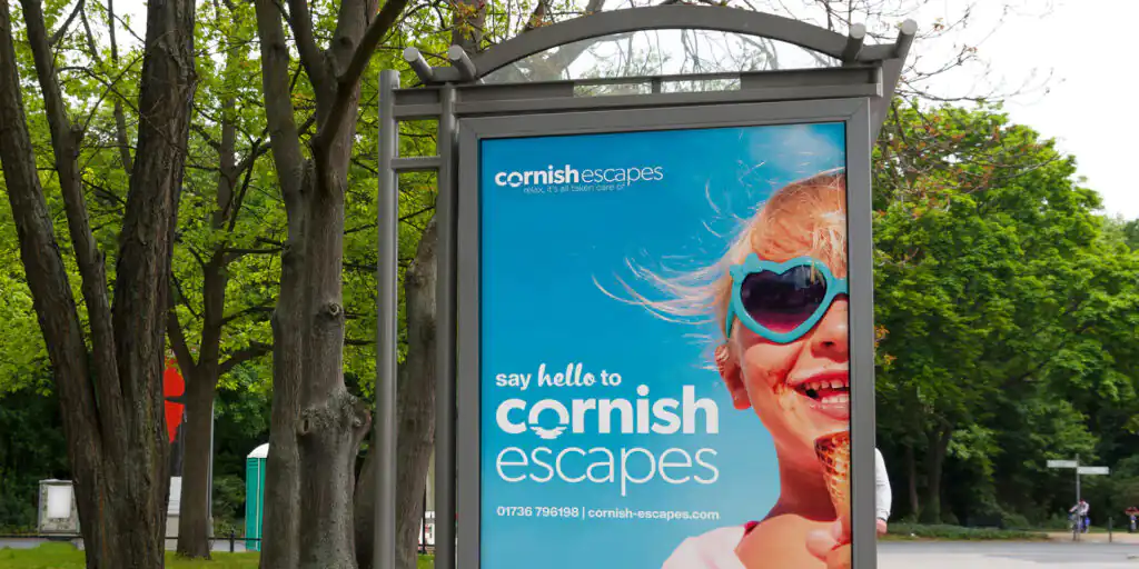 Cornish Escapes' new brand language, following its redesign in 2022, featured here on a bust stop.