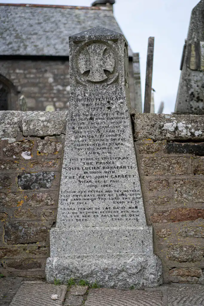 Monument honouring Dolly Pentreath, featuring a plaque that celebrates her legacy as one of the most famous Cornish women.