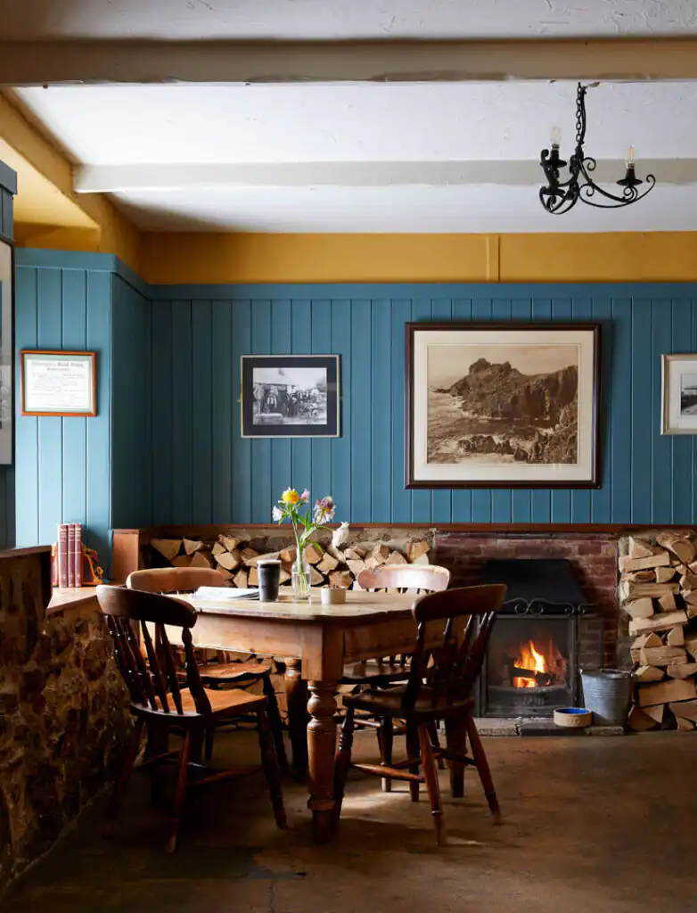 A cosy dining room at the Gurnard's Head Restaurant, featuring a table and chairs, set to celebrate romantic Valentine's Day dinner in Cornwall.