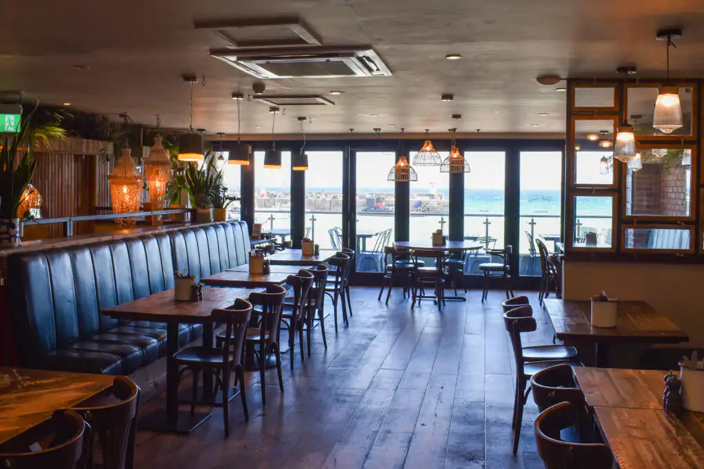 Interior view of Hub St Ives, looking out across St Ives Harbour, one of the best Restaurants in St Ives.