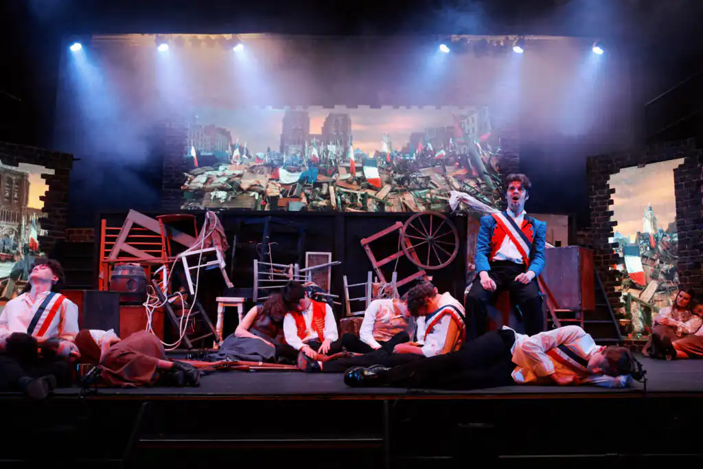 A group of people on stage at a Kidz R Us production in St Ives in Cornwall, one of many theatres to visit in Cornwall.