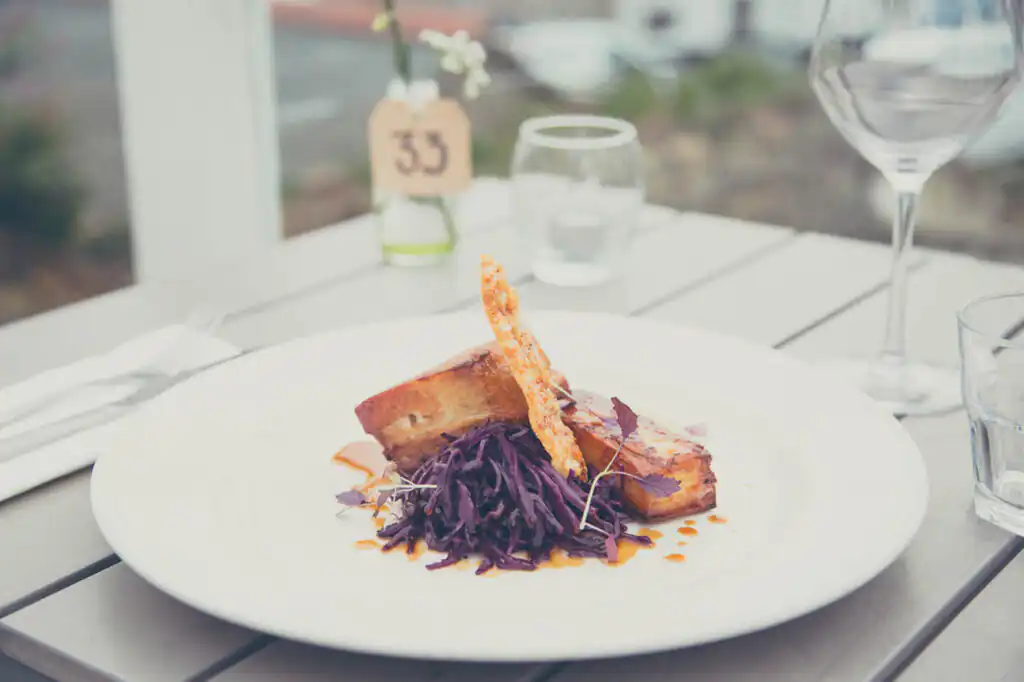 A delicious plate of food served on a table at The Loft, a popular dining spot in St Ives, and a great place to eat out in Cornwall.