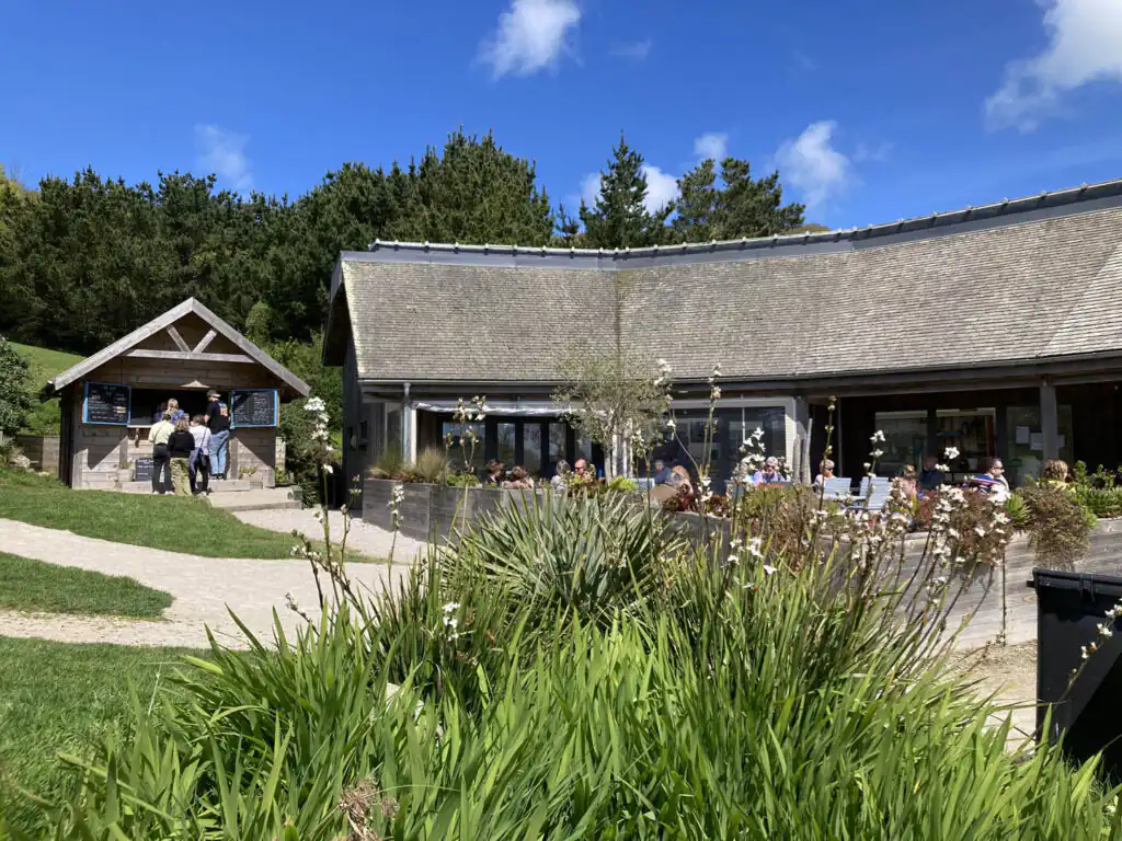 Tremenheere Kitchen on a hillside, surrounded by lush grass and trees, perfect for a romantic Valentine's Day in Cornwall.