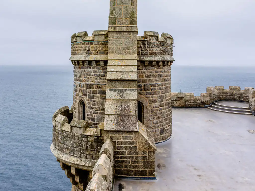 Turret on St Michael's Mount, Marazion, showcasing historic architecture against a clear blue sky, one of many pieces of heritage in Marazion.