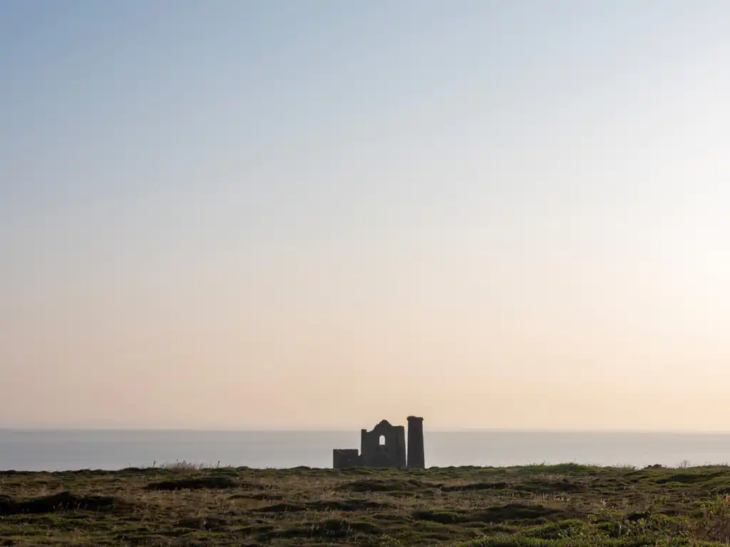 Wheal Coates Mine ruins stands on a hill, gazing over the ocean, remnants of mining history near St Agnes.