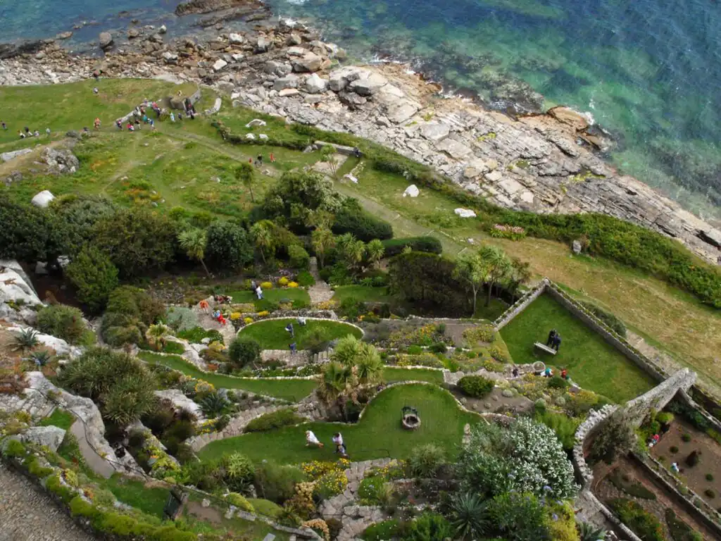 Scenic view of the sea and lush gardens atop a hill at St Michael's Mount, a great piece of arts and heritage in Marazion.