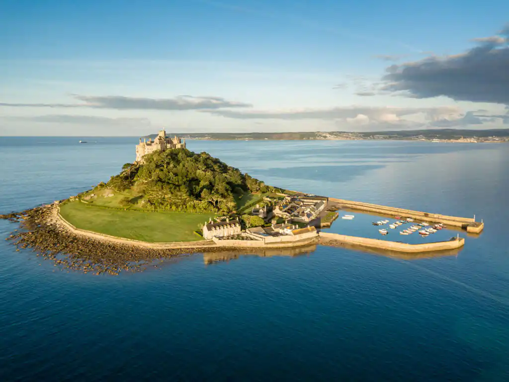 Aerial view of St Michael's Mount in Cornwall, an idyllic boat trip awaits around this historic monument.