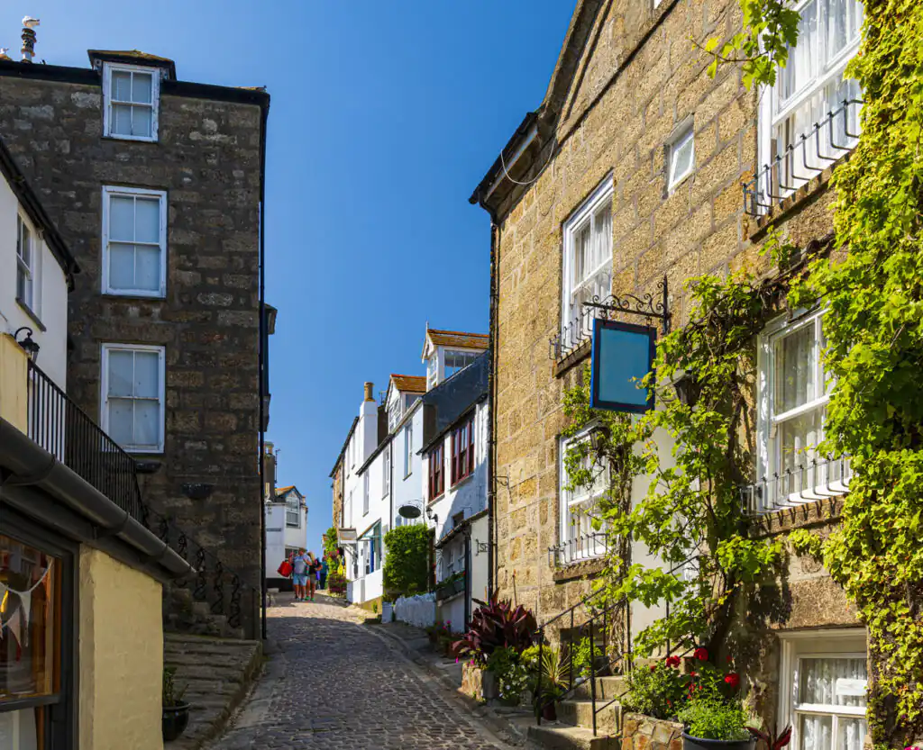 St Ives street features charming brick buildings and cobbles, a highlight of the Salt Path Walk in Cornwall.